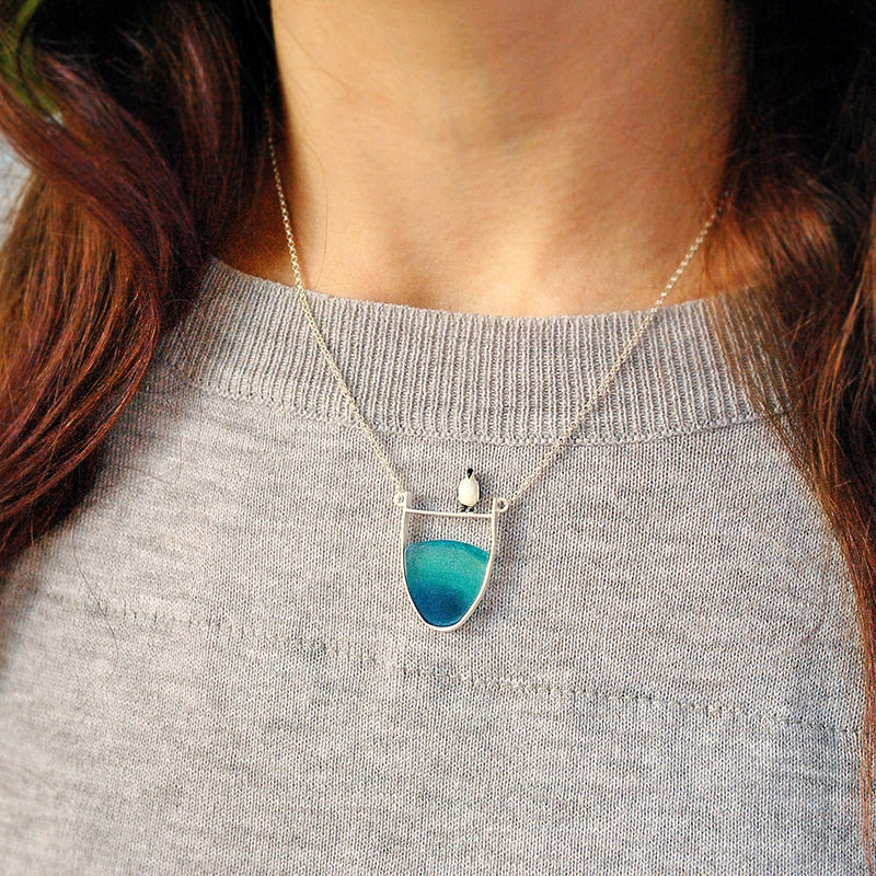 Collier pendentif Pingouin sur la banquise